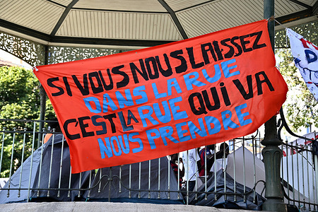 A Banner reading "If you leave us in the street, it's the street that will take us" hangs from a bandstand where unaccompanied migrant children (juveniles) are camping. Unaccompanied migrant children (minors) are housed in a camp under a bandstand at Marseille town hall.