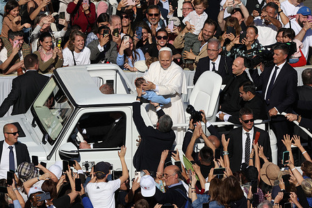 Pope Leo XIV climbs into the Popemobile and makes a tour of St. Peter's Square to greet the faithful and bless the children who attended the Mass on the Solemnity of All Saints. The pontiff proclaimed the Englishman St. John Henry Newman (a former Anglican convert to Catholicism and founder of the Order of St. Philip Neri) a Doctor of the Church.