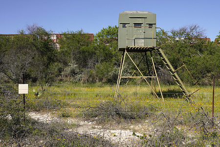 A border patrol watch tower faces the Rio Grande in Del Rio Texas.