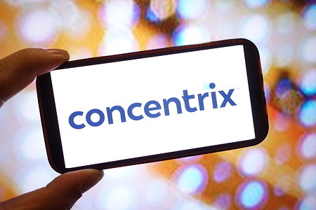 In this photo illustration, a Concentrix company logo is seen displayed on a smartphone screen.