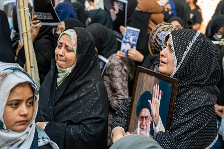 A woman expressed her grief and held a poster of Iranian Supreme Leader Ayatollah Ali Khamenei as members of the Shia community gather at Jantar Mantar to attend a protest and condolence assembly organized to express grief and condemnation in New Delhi. The Ulema of Delhi and the All India Shia Council organized the demonstration following the reported death of Iranian Supreme Leader Ayatollah Ali Hosseini Khamenei in an attack by the United States and Israel