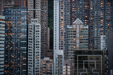 Hong Kong skyline with skyscrapers blocking the view of the mountain.
