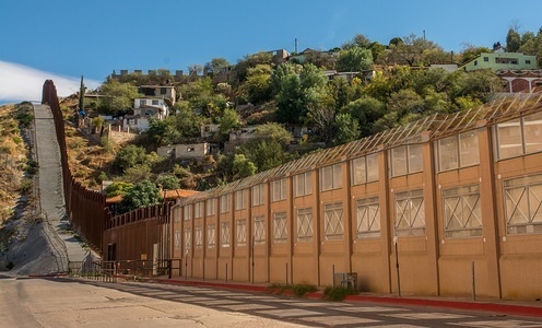 The border wall at the US - Mexico border in the city of Nogales, Arizona
According to the U.S. Customs and Border Protection there are at least 580 miles of physical barriers in place to divide United States and Mexico in 2009. The Trump administration wants to extent the barriers to cover the whole 1989 miles of total length of the border between the two countries.