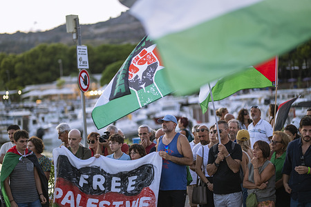 Protesters hold a banner with inscriptions “Free Palestine” during the demonstration. People gathered at the port of Roccella Jonica with pro-Palestinian flags to support the preparation of the boat “Brucaliffo” to join Freedom Flotilla Italia.