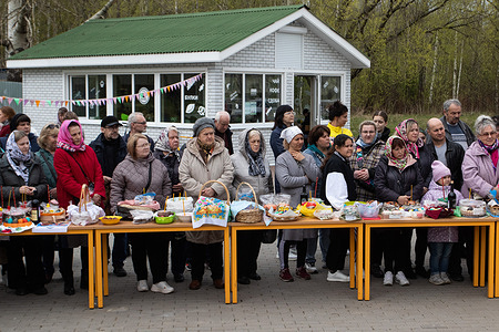 Believers wait for an Orthodox priest to bless them, with their gifts on the table next to a church in St. Petersburg. Russia and Orthodox Christians celebrate the Holy Resurrection of Christ on May 5th. The celebration of Easter will mark the end of Lent and Holy Week in 2024. Easter is the most ancient Christian holiday. It symbolizes the victory of life over death and is traditionally considered the most important date in the Orthodox calendar.