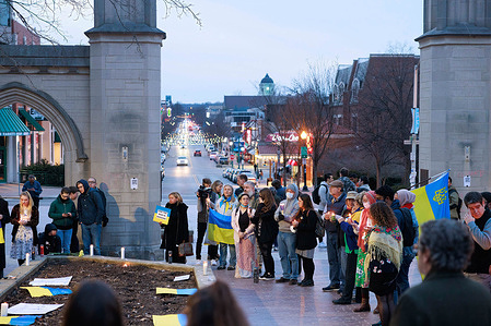 Anti-war demonstrators gather during a Candlelight Vigil for Ukraine at Indiana University's Sample Gates to protest the Russian invasion of Ukraine.
The Russian military began an invasion of Ukraine on February 24, 2022.