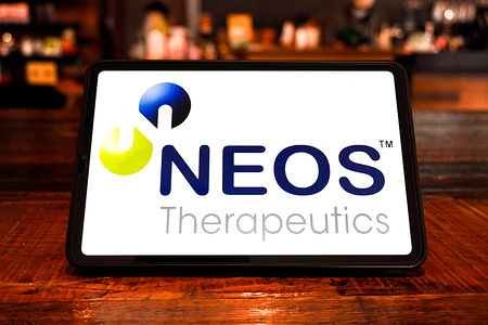 In this photo illustration, the NEOS Therapeutics logo is seen displayed on the screen of a smart tablet.