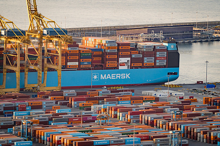 Shipping containers and cargo ships seen in the port of Barcelona one of the biggest sea ports of Europe. Global trade faces uncertainty amidst potential tariffs imposed by Trump which could affect the trade relationship between the European Union (EU) and the US.