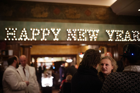 Happy new year sign seen at the door entrance during the years celebrations in Vienna. Several stages with different styles of music, from Classic to Rock, were performing in Silvesterpfad, Vienna.