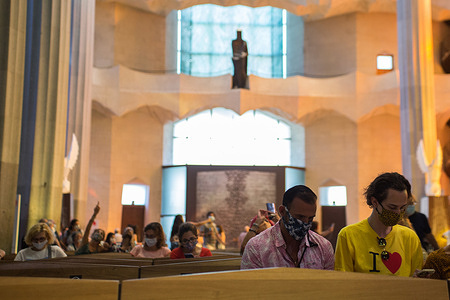 People wearing face mask as a preventive measure are seen at the Sagrada Familia.
Barcelona residents visit La Sagrada Familia following strict Coronavirus (Covid-19) rules by allowing only few people at a time to enter the church in order to fight the spread of the virus.