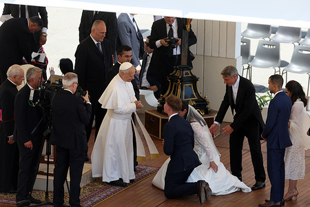 Pope Leo XIV greets married couples after the Wednesday audience at St. Peter's Square.