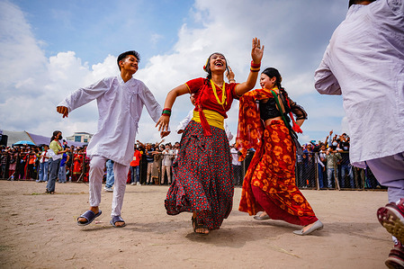 Nepali devotees in traditional attire dance during the Gaura Parva festival in Kathmandu. The Gaura festival is celebrated by people from the far western Nepal region to commemorate the wedding of goddess Gaura (Parvati) to Lord Shiva, by fasting the whole day for the happiness and prosperity of their family.
