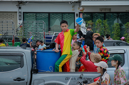 A young boy splashes water during the Songkran festival in Mae Sot, Thailand. The Songkran Festival is celebrated in Mae Sot, a city located along the Thai-Myanmar border. The festival features a mix of Thai and Myanmar traditions, bringing together people from both sides of the border, including Thais, Burmese, and various ethnic groups. Participants enjoy water-splashing activities, cultural performances, and religious rituals. As the celebration marks the Thai New Year, it is well-known for its traditional water fights and vibrant cultural events.