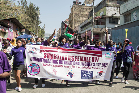 Protesters march while holding a banner during the rally for gender equality on International Women's Day.
In Kenya, this year's celebration came just a day after a lady motorist was allegedly molested by a gang of Boda Boda riders (motorcycle taxi operators) in Nairobi, an incident that led to a national outrage and condemnation.