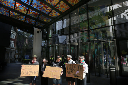 Protesters hold placards expressing their opinion during the demonstration. Protesters gathered outside London specialist insurer Beazley Group. Beazley has become a focal point for climate protests, driven by concerns over its underwriting of fossil fuel expansion and the energy demands of AI data centres. They are demanding ‘No renewals of fossil fuel contracts’ and ‘no insurance for fossil infrastructure rebuilds’. They held signs to raise awareness amongst the passing members of public.