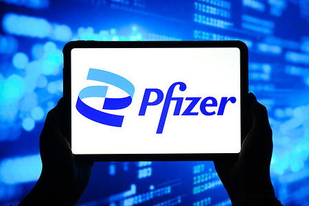 In this photo illustration, the logo of Pfizer is displayed on the screen of a smart tablet.