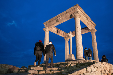 Tourists visit the Los Cuatro Postes lookout in Ávila. This UNESCO World Heritage site features some of the best-preserved fortifications in Europe.