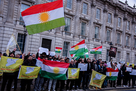 Supporters of the Iranian Resistance rally at Downing Street holding Kurdish flags and banners. Supporters have been expressing their solidarity with the nationwide protests in Iran that erupted on December 28, 2025.