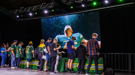 Fans get player's autographs at The Edmonton Elk's 2025 Player Uniforms introduction event ahead of the Season Opener at Midway Music Hall.