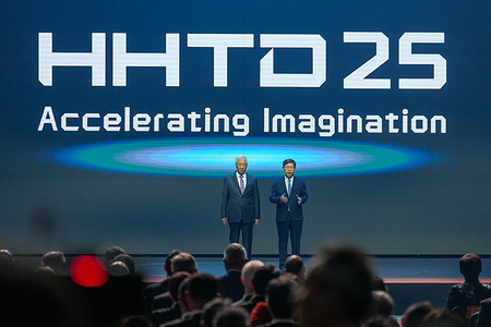 Young Liu (R), the Chairman of Hon Hai Technology Group (Foxconn) and Terry Guo (R), Foxconn founder on the stage at the Hon Hai tech day 2025 (HHTD2025) an annual event that showcases their latest technological advancements, particularly in areas like smart manufacturing, AI, and electric vehicles (EVs).