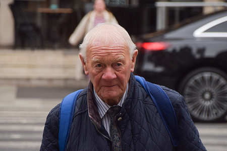 Barry Laycock, one of the claimants, arrives at the Royal Courts of Justice as the lawsuit against former Sinn Fein leader Gerry Adams by three victims injured in IRA bombings in England in 1973 and 1996 continues.