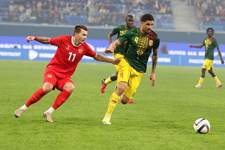 Dmitriy Vorobyov (11) of Russia, and Nathan Gassama (4) during the BetBoom friendly football match Russia - Mali in Saint Petersburg, at the Gazprom Arena. The final score, Russia 0:0 Mali.