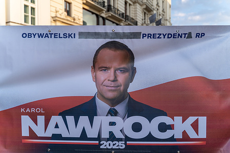 A banner with a picture of Karol Nawrocki seen during a demonstration. Members of parliament from the party Law and Justice (PiS) together with supporters and members of clubs associated with Gazeta Polska Clubs organized a rally in support of President Karol Nawrocki after he vetoed legislation enabling Poland to access funds from the European Union’s SAFE program. The SAFE program (Security Action for Europe) is a €150 billion EU financial instrument launched in 2025 that provides long-term, low-interest loans to support defense investments, including the purchase of military equipment and the strengthening of the European defense industry. Poland was expected to be one of the largest beneficiaries of the program. Several hundred people gathered at the rally to express their support for the president in Warsaw.