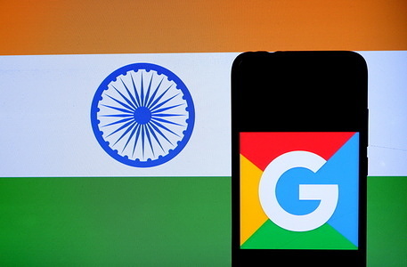 In this photo illustration a Google Logo seen displayed on a smartphone with an Indian Flag displayed in the background.