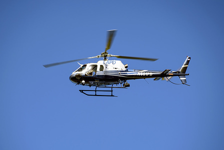 A Los Angeles Police Department helicopter seen flying over the LAPD Academy during a ceremony in honor of the 150th Anniversary of the LAPD in Los Angeles, California.