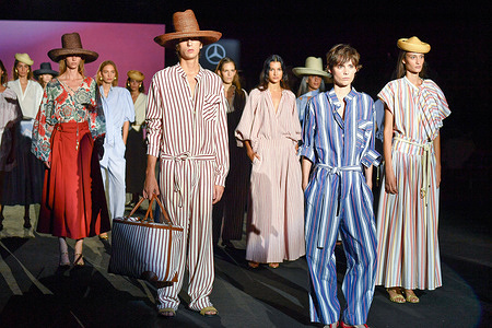 Models walk the runway wearing a design by The Label Edition during Mercedes-Benz Fashion Week de Madrid in IFERMA.