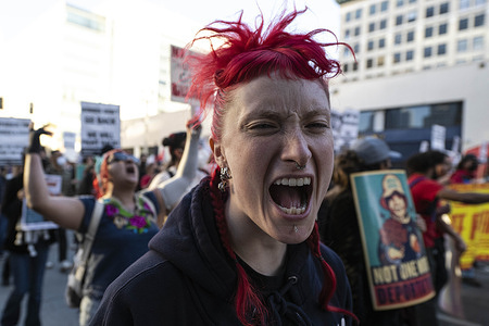 A protester screams out of anger after the announcement of Trump s' swearing in as the 47th President of the United States. Protesters rallied and marched at City Hall in downtown Los Angeles after Trump was sworn in as the 47th President of the United States.