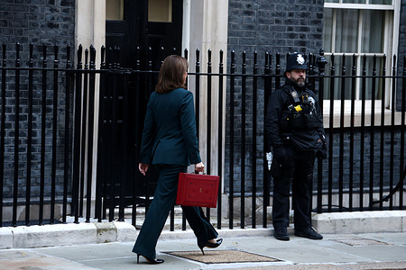 Chancellor of the Exchequer, Rachel Reeves, poses with the red Budget Box as she leaves 11 Downing Street to present the government's annual budget to Parliament.