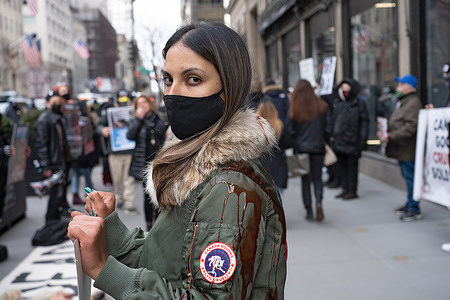 A protester wearing a Canada Goose coat covered with fake blood stands in a pool of blood during the demonstration.
Animal rights activists held a peaceful protest in front of Saks Fifth Avenue. Protest against the Canada goose brand specifically, which this retailer sells. Protesters called on Saks Fifth Avenue to stop selling "products" made with fur from chinchillas, foxes, lambs, minks, raccoon dogs and rabbits.