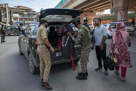Indian security personnel search a car along a roadside during a random search operation following recent militant attacks, in Srinagar, the summer capital of Jammu and Kashmir. Indian security forces have intensified counterinsurgency operations across Kashmir region following the fatal shooting of a police officer in Anantnag district on July 23 and the killing of two nonlocal labourers in neighbouring Kulgam district on August 1. Troops, police and paramilitary forces have expanded cordon and search operations, increased vehicle checks and surveillance, and detained suspects as authorities seek to track down those responsible. The attacks have renewed concerns over militant activity in the Himalayan region, where an armed insurgency against Indian rule has persisted since 1989.