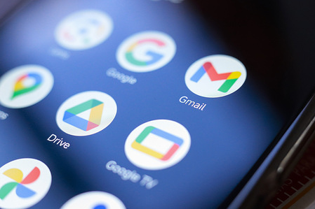 In this photo illustration, Google, Google Lens, Gmail and Drive apps displayed on a smartphone screen.