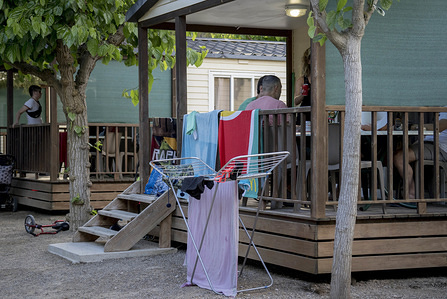 Friends and family gather together on the terrace of a tourist bungalow during the covid 19 crisis.
Regional tourists are beginning to travel to some campsites on the coast of Spain following the relaxation of confinement restrictions towards a new normality.