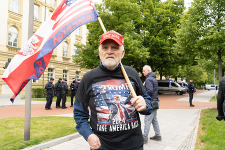 A man wearing a T-shirt that reads Trump Take America Back ” takes part in the demonstration. Nationalist groups gathered in Warsaw, to participate in a demonstration titled "March Against Migration," organized by the Border Defense Movement (Ruch Obrony Granic). Held under the slogan "Stop the wave of mass migration from alien cultures," the protest called for stricter border controls and the deportation of undocumented migrants. Organizers criticized Germany for allegedly transferring detained migrants into Poland. Participants carried banners and chanted nationalistic and anti-immigration slogans, some of which were explicitly xenophobic in tone.