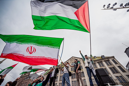 Pro-Palestinian protesters wave flags, during the demonstration. Land Day Protest for Palestine at the Dam in Amsterdam, and then a walk through the city centre, was led by a substantial crowd of demonstrators. ‘Land Day serves as a powerful symbol of the Palestinian people’s deep connection to their ancestral land and their ongoing struggle against displacement. On this day, we take to the streets of Amsterdam to stand in solidarity, demand justice, and honor those who protect the land.