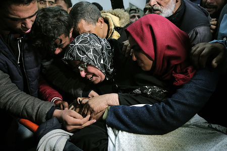 Relatives to Ihab Abed seen wailing in a hospital morgue where his body was after his death. 
Palestinian Ihab Abed, 25, was killed by Israeli soldiers in the southern Gaza Strip while trying to disperse demonstrators taking part in the grand march along the fence between Gaza and Israel.