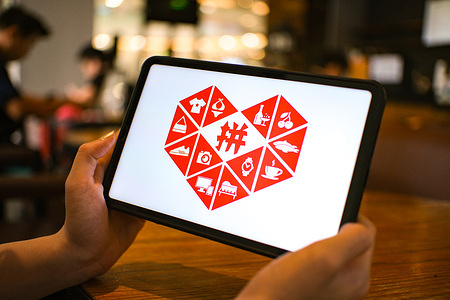 In this photo illustration, the Pinduoduo logo is seen displayed on a tablet screen.