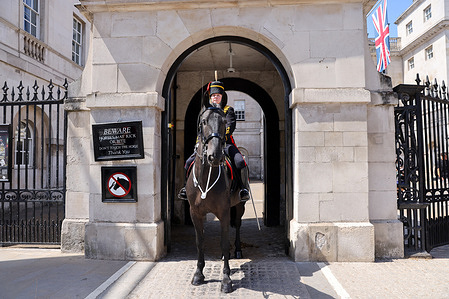A female sentry on horseback is stationed at the arch of Horse Guards in London on a warm and sunny day in the capital. The Met Office has issued a forecast predicting a heatwave expected to last for over ten days.