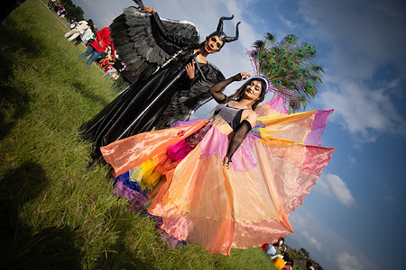 Participants in fancy costumes take part during the Pride parade. Blue Diamond Society, an LGBTQ rights organization in Nepal, with the assistance of the US Embassy in Nepal, organized a pride march and a musical event during the Gai Jatra festival. The participants of the pride march called for the government to implement equality and rights of the members of the LGBTQ community under the country's new constitution. Gai Jatra is a Nepalese festival celebrated in honor of their immediate relatives who died in the previous year.