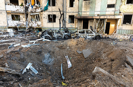 A rocket crater in front of a residential building following a Russian rocket attack. As the Russian invasion of Ukraine drags into it's third week, Russian forces have increasingly begun to target residential areas of Kyiv causing civilian casualties and large scale destruction to apartment buildings and infrastructure.