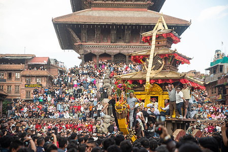 Nepalese devotees celebrate and pull the chariot of Lord Bhairab to mark the beginning of the Biska Jatra festival. The Biska Jatra starts the countdown for the Nepali New Year which begins with the two groups of locals engaging in a tug-of-war to pull the Lord Bhairav chariot to either side of the city area.