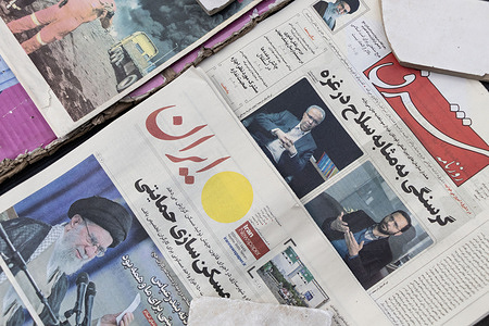 An Iranian newspaper covering the Iran-U.S. negotiations is seen displayed at a newsstand, featuring a prominent portrait of Iran’s Supreme Leader, Ali Khamenei on the front page. After three rounds of negotiations between Iran and the U.S. in Oman and Rome, the fourth round was suddenly canceled. News of the negotiations is covered by most Iranian media outlets.