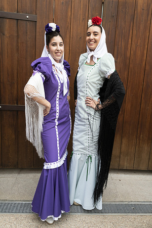 Participants in Chulapa costumes take part in the traditional parade Dancing through Madrid, a popular event during the San Isidro Festival at Corrala de Madrid.