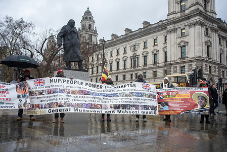 Ugandan protesters hold banners and flags by the Winston Churchill sculpture on the Parliament Square during the rally. Activists from Uganda’s People Power, Our Power movement gathered outside the UK Parliament in London to protest against President Yoweri Museveni’s decades-long rule. Led by opposition figure Bobi Wine, the movement condemns what it describes as authoritarian governance marked by corruption, human rights abuses, and alleged electoral fraud during the 2026 general elections. Protesters called for international attention and support for a democratic transition driven by Uganda’s younger generation.