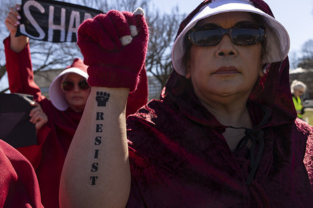 Protesters demonstrate against President Donald Trump and his administration during the “March 4 Democracy” rally on the National Mall. The rally, planned before Trump announced that the United States and Israel launched coordinated strikes on Iran that morning, drew thousands calling for democratic accountability and opposition to the military action.