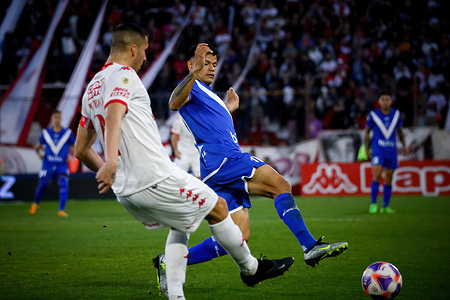 Fernando Tobio (L) of Huracan and Walter Bou (R) of Velez seen in action during the match between Huracan and Velez as part of Liga Profesional de Futbol - Fecha 27 at Tomas Adolfo Duco Stadium. Final score: Huracan 1 - 0 Velez