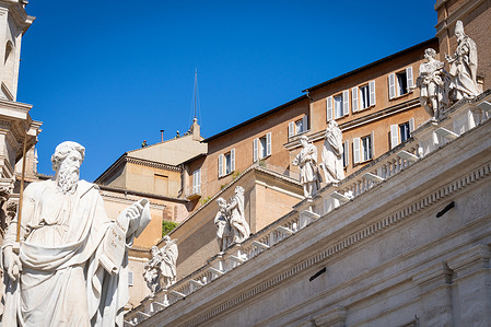 Firefighters install the chimney on the roof, at the Sistine Chapel where cardinals will gather to elect the new pope. Smoke will come out of the chimney announcing the choice of the new Pope.